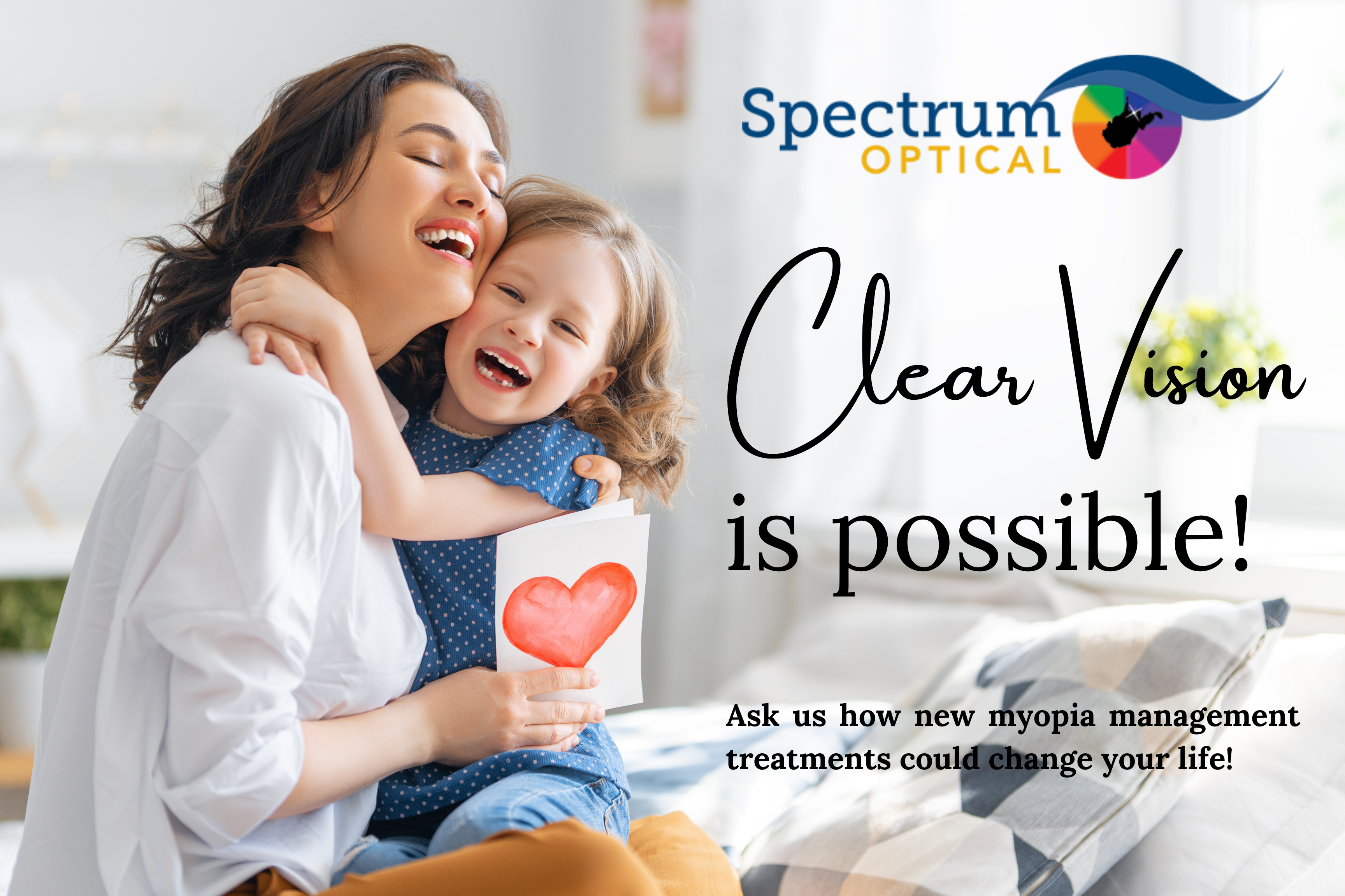 A mother and daughter smile and embrace beside the Spectrum Optical logo